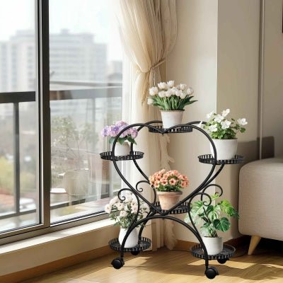 porte plante verdeco forme coeur noir six plateaux devant baie vitrée