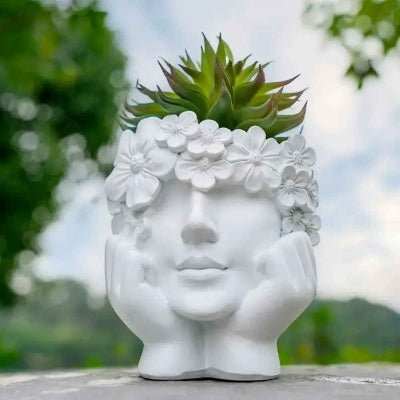 pot de fleur diademe de fleurs blanc en forme de visage féminin 